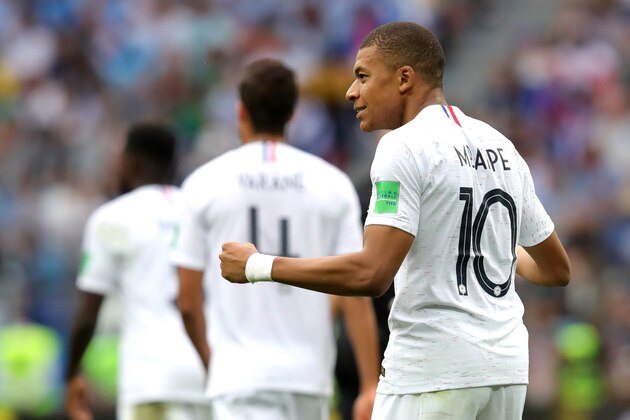 NIZHNY NOVGOROD, RUSSIA - JULY 06:  Kylian Mbappe of France celebrates after teammate Antoine Griezmann scores their team's second goal during the 2018 FIFA World Cup Russia Quarter Final match between Uruguay and France at Nizhny Novgorod Stadium on July 6, 2018 in Nizhny Novgorod, Russia.  (Photo by Alexander Hassenstein/Getty Images)