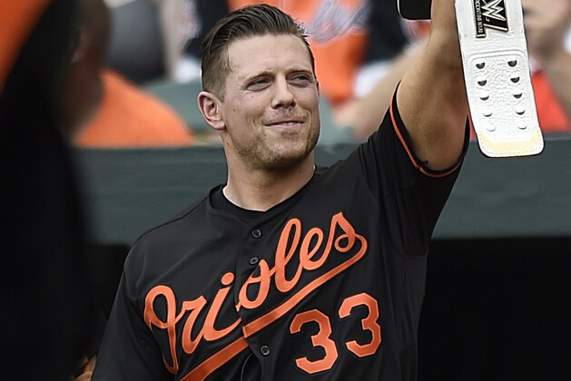 WWE Champion The Miz greets the fans before throwing out the ceremonial first pitch before the Baltimore Orioles and Cleveland Indians baseball game, Saturday, July 23, 2016 in Baltimore. (AP Photo/Gail Burton)