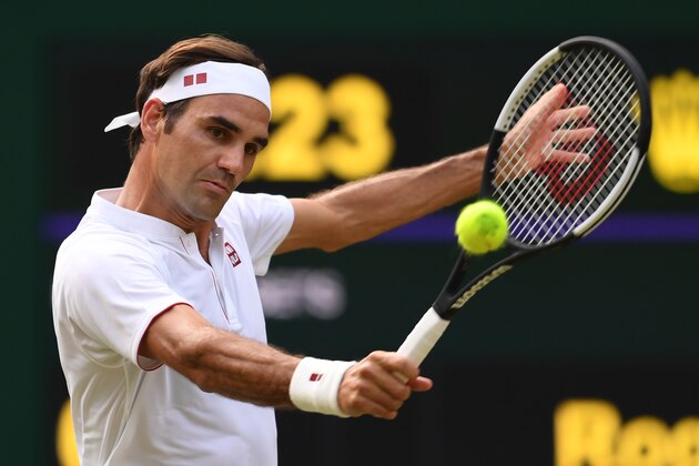 Switzerland's Roger Federer returns to Germany's Jan-Lennard Struff in their men's singles third round match on the fifth day of the 2018 Wimbledon Championships at The All England Lawn Tennis Club in Wimbledon, southwest London, on July 6, 2018. (Photo by Glyn KIRK / AFP) / RESTRICTED TO EDITORIAL USE        (Photo credit should read GLYN KIRK/AFP/Getty Images)