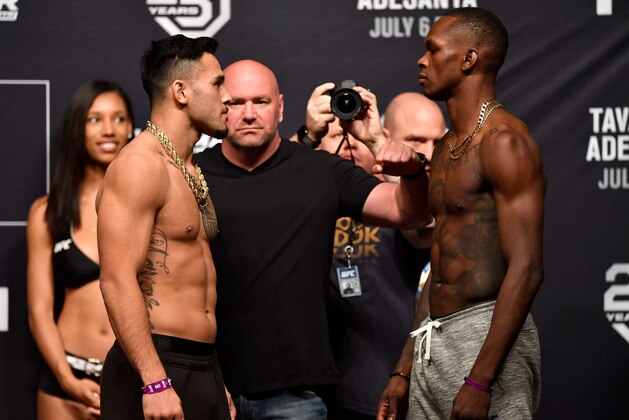 LAS VEGAS, NV - JULY 05:  (L-R) Opponents Brad Tavares and Israel Adesanya of Nigeria face off during The Ultimate Fighter Finale weigh-in inside The Pearl concert theater at Palms Casino Resort on July 5, 2018 in Las Vegas, Nevada. (Photo by Jeff Bottari/Zuffa LLC/Zuffa LLC via Getty Images)