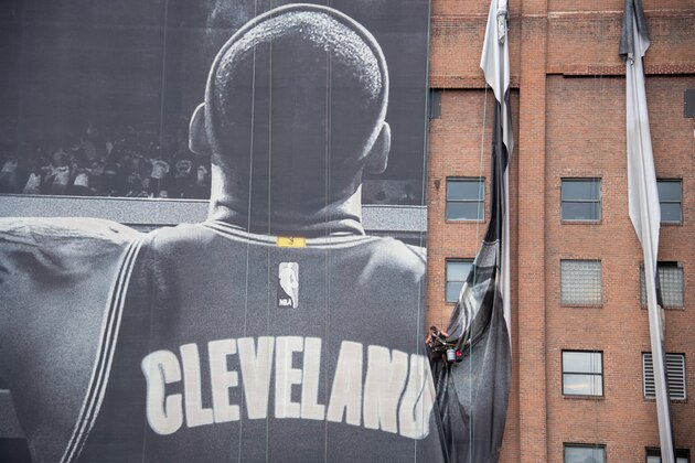 CLEVELAND, OH - JULY 3: Workers remove the Nike LeBron James banner from the Sherwin-Williams building near Quicken Loans Arena on July 3, 2018 in Cleveland, Ohio. NOTE TO USER: User expressly acknowledges and agrees that, by downloading and or using this photograph, User is consenting to the terms and conditions of the Getty Images License Agreement. (Photo by Jason Miller/Getty Images)