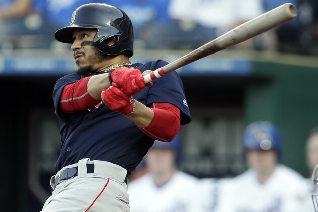 Boston Red Sox's Mookie Betts follows through on a solo home run off Kansas City Royals starting pitcher Jason Hammel during the first inning of a baseball game at Kauffman Stadium in Kansas City, Mo., Friday, July 6, 2018. (AP Photo/Orlin Wagner)