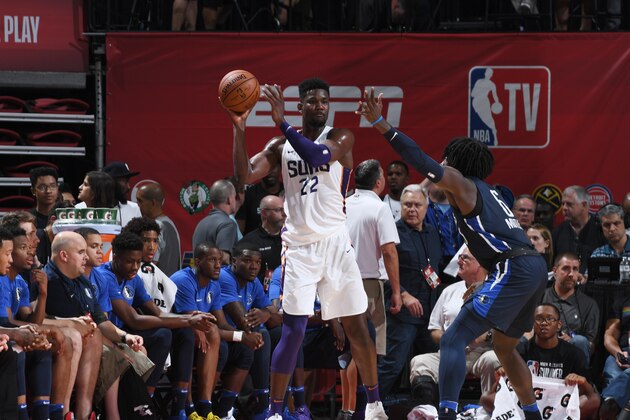 LAS VEGAS, NV - JULY 6:  Deandre Ayton #22 of the Phoenix Suns handles the ball against the Dallas Mavericks during the 2018 Las Vegas Summer League on July 6, 2018 at the Thomas & Mack Center in Las Vegas, Nevada. NOTE TO USER: User expressly acknowledges and agrees that, by downloading and/or using this Photograph, user is consenting to the terms and conditions of the Getty Images License Agreement. Mandatory Copyright Notice: Copyright 2018 NBAE (Photo by Garrett Ellwood/NBAE via Getty Images)