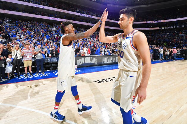 PHILADELPHIA, PA - APRIL 14:  Robert Covington #33 and Furkan Korkmaz #30 of the Philadelphia 76ers exchange high fives in game one of round one of the 2018 NBA Playoffs against the Miami Heat on April 14, 2018 at Wells Fargo Center in Philadelphia, Pennsylvania NOTE TO USER: User expressly acknowledges and agrees that, by downloading and/or using this Photograph, user is consenting to the terms and conditions of the Getty Images License Agreement. Mandatory Copyright Notice: Copyright 2018 NBAE (Photo by Jesse D. Garrabrant/NBAE via Getty Images)