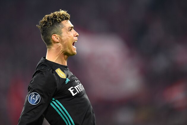 TOPSHOT - Real Madrid's Portuguese forward Cristiano Ronaldo reacts after scoring a goal that was disallowed during the UEFA Champions League semi-final first-leg football match FC Bayern Munich v Real Madrid CF in Munich in southern Germany on April 25, 2018. (Photo by Christof STACHE / AFP)        (Photo credit should read CHRISTOF STACHE/AFP/Getty Images)