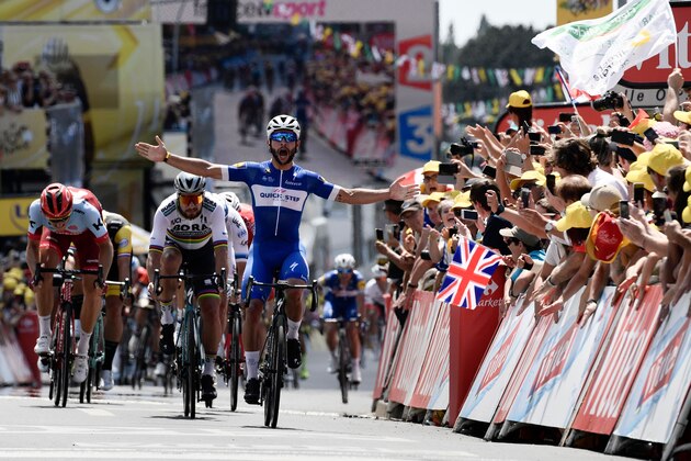 Colombia's Fernando Gaviria celebrates as he crosses the finish line to win the first stage of the 105th edition of the Tour de France cycling race between Noirmoutier-en-l'ile and Fontenay-le Comte, western France, on July 7, 2018. (Photo by Philippe LOPEZ / AFP)        (Photo credit should read PHILIPPE LOPEZ/AFP/Getty Images)