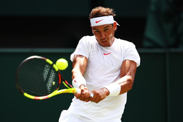LONDON, ENGLAND - JULY 07:  Rafael Nadal of Spain returns a shot against Alex De Minaur of Australia during their Men's Singles third round match on day six of the Wimbledon Lawn Tennis Championships at All England Lawn Tennis and Croquet Club on July 7, 2018 in London, England.  (Photo by Clive Brunskill/Getty Images)