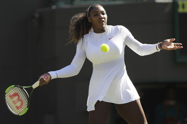 Serena Williams of the US returns a ball to Arantxa Rus of the Netherlands during the Women's Singles first round match at the Wimbledon Tennis Championships in London, Monday July 2, 2018. (AP Photo/Kirsty Wigglesworth)