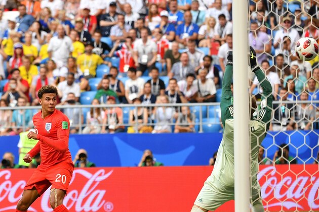 England's midfielder Dele Alli (L) heads the ball to score his team's second goal during the Russia 2018 World Cup quarter-final football match between Sweden and England at the Samara Arena in Samara on July 7, 2018. (Photo by Yuri CORTEZ / AFP) / RESTRICTED TO EDITORIAL USE - NO MOBILE PUSH ALERTS/DOWNLOADS        (Photo credit should read YURI CORTEZ/AFP/Getty Images)