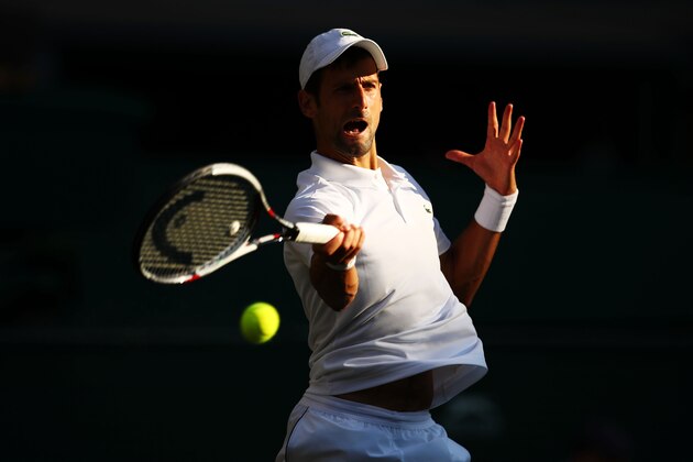 LONDON, ENGLAND - JULY 07:  Novak Djokovic of Serbia returns a shot against Kyle Edmund of Great Britain during their Men's Singles third round match on day six of the Wimbledon Lawn Tennis Championships at All England Lawn Tennis and Croquet Club on July 7, 2018 in London, England.  (Photo by Clive Brunskill/Getty Images)
