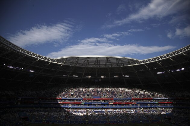Spectators on the stands wait for the start of the quarterfinal match between Sweden and England at the 2018 soccer World Cup in the Samara Arena, in Samara, Russia, Saturday, July 7, 2018. (AP Photo/Thanassis Stavrakis)