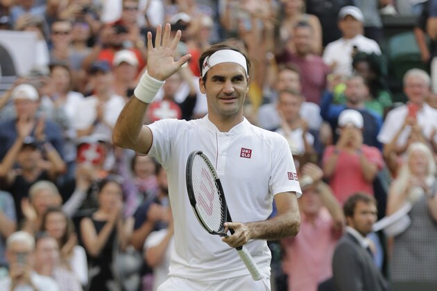 Switzerland's Roger Federer celebrates winning his men's singles match against Germany's Jan-Lennard Struff, on the fifth day of the Wimbledon Tennis Championships in London, Friday July 6, 2018. (AP Photo/Ben Curtis)