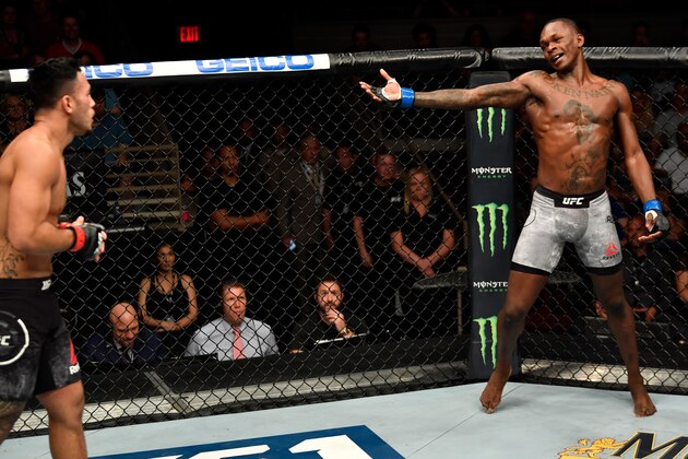 LAS VEGAS, NV - JULY 06:  (R-L) Israel Adesanya of Nigeria taunts Brad Tavares in their middleweight bout during The Ultimate Fighter Finale event inside The Pearl concert theater at Palms Casino Resort on July 6, 2018 in Las Vegas, Nevada. (Photo by Jeff Bottari/Zuffa LLC/Zuffa LLC via Getty Images)