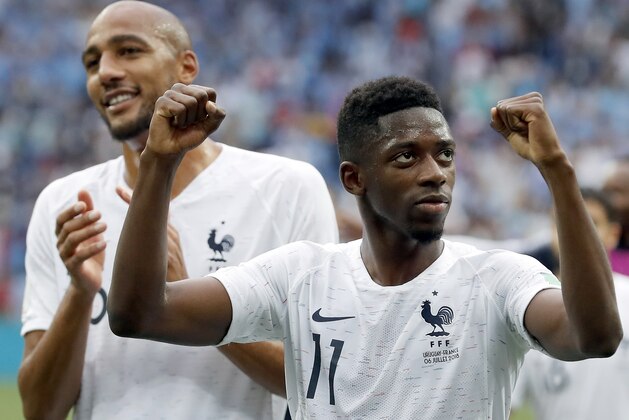 France's Ousmane Dembele, front celebrates after the quarterfinal match between Uruguay and France at the 2018 soccer World Cup in the Nizhny Novgorod Stadium, in Nizhny Novgorod, Russia, Friday, July 6, 2018. France defeated Uruguay by 2-0. (AP Photo/David Vincent)