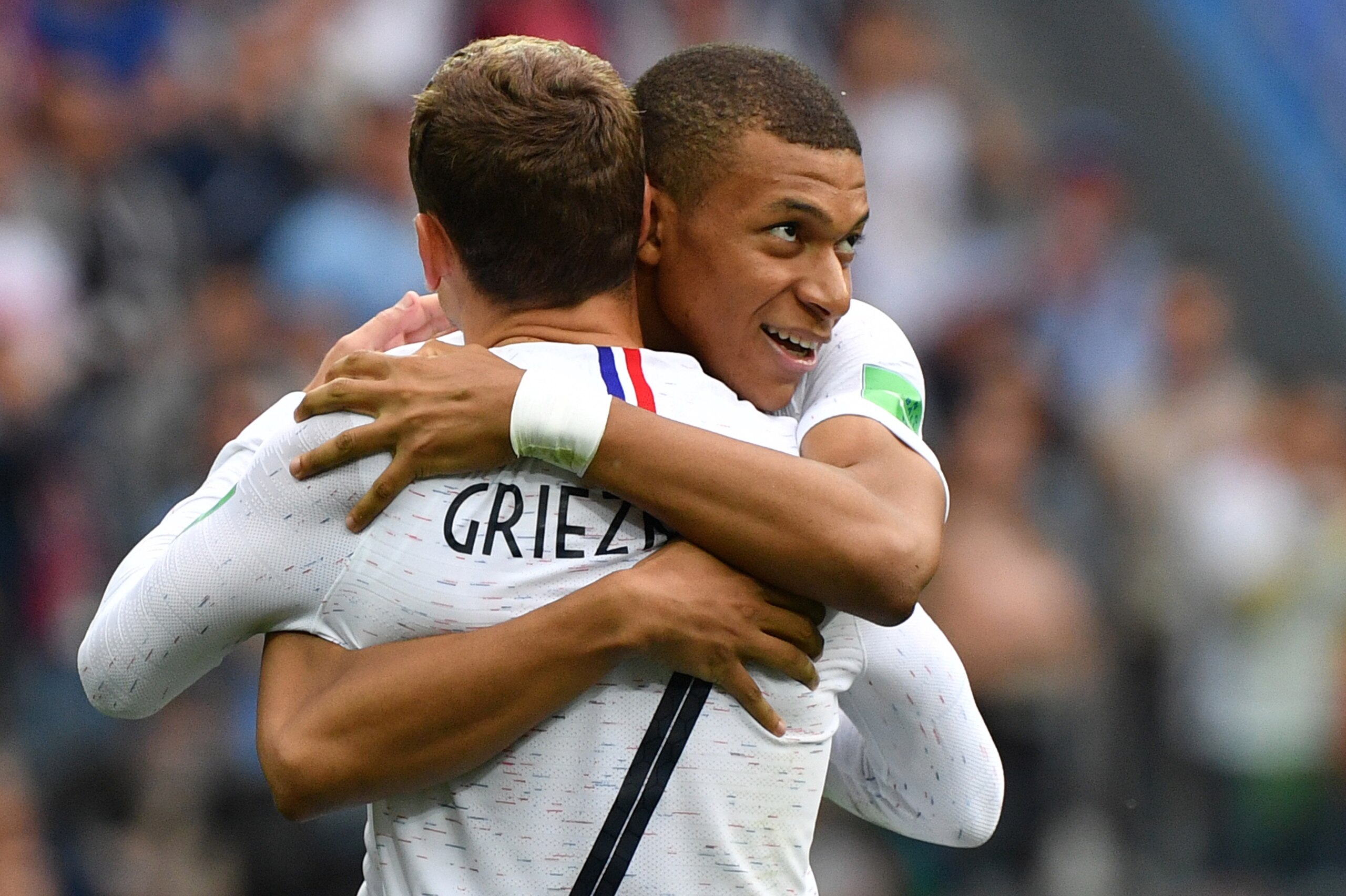 TOPSHOT - France's forward Antoine Griezmann (L) celebrates his goal with France's forward Kylian Mbappe during the Russia 2018 World Cup quarter-final football match between Uruguay and France at the Nizhny Novgorod Stadium in Nizhny Novgorod on July 6, 2018. (Photo by Dimitar DILKOFF / AFP)        (Photo credit should read DIMITAR DILKOFF/AFP/Getty Images)