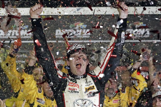 Erik Jones celebrates in Victory Lane after winning the NASCAR Cup Series auto race at Daytona International Speedway, Saturday, July 7, 2018, in Daytona Beach, Fla. (AP Photo/John Raoux)