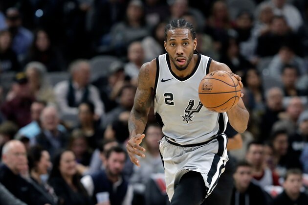 FILE - In this Jan. 13, 2018, file photo, San Antonio Spurs forward Kawhi Leonard (2) moves the ball up court during the second half of an NBA basketball game against the Denver Nuggets, in San Antonio. General manager R.C. Buford acknowledges star forward Kawhi Leonard is unhappy with the Spurs. He remains optimistic the relationship can be salvaged. (AP Photo/Eric Gay, File)
