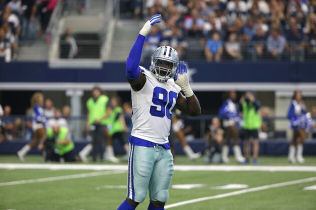 Dallas Cowboys defensive end DeMarcus Lawrence (90) motivates fans during an NFL football game against the Los Angeles Rams on Sunday, Oct. 1, 2017, in Arlington, Texas. (AP Photo/Roger Steinman)