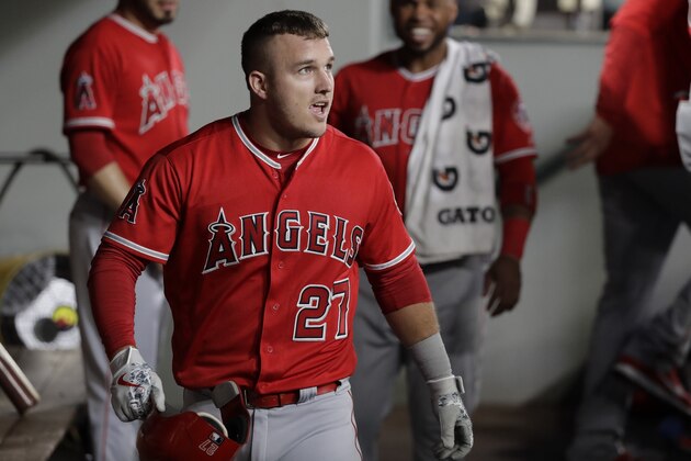 Los Angeles Angels' Mike Trout walks in the dugout after hitting a home run during a baseball game against the Seattle Mariners, Monday, June 11, 2018, in Seattle. (AP Photo/Ted S. Warren)