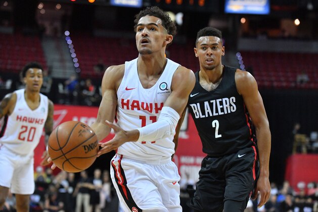 LAS VEGAS, NV - JULY 08:  Trae Young #11 of the Atlanta Hawks passes the ball as Wade Baldwin IV #2 of the Portland Trail Blazers looks on during the 2018 NBA Summer League at the Thomas & Mack Center on July 8, 2018 in Las Vegas, Nevada. NOTE TO USER: User expressly acknowledges and agrees that, by downloading and or using this photograph, User is consenting to the terms and conditions of the Getty Images License Agreement.  (Photo by Sam Wasson/Getty Images)