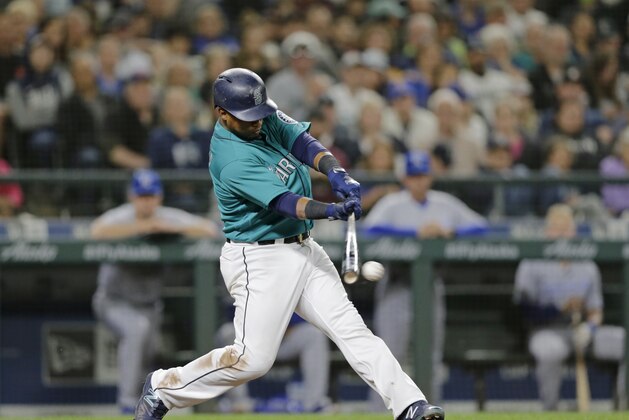 Seattle Mariners' Jean Segura hits and RBI single against the Kansas City Royals during a baseball game, Friday, June 29, 2018, in Seattle. (AP Photo/John Froschauer)