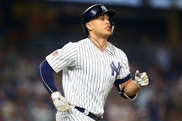 NEW YORK, NY - JULY 03:  Giancarlo Stanton #27 of the New York Yankees hits a 2-run home run in the bottom of the eighth inning against the Atlanta Braves at Yankee Stadium on July 3, 2018 in the Bronx borough of New York City.  (Photo by Mike Stobe/Getty Images)
