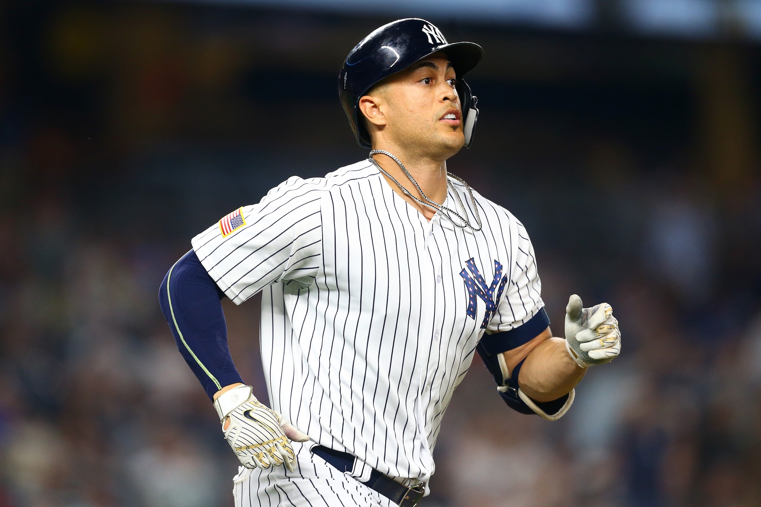 NEW YORK, NY - JULY 03:  Giancarlo Stanton #27 of the New York Yankees hits a 2-run home run in the bottom of the eighth inning against the Atlanta Braves at Yankee Stadium on July 3, 2018 in the Bronx borough of New York City.  (Photo by Mike Stobe/Getty Images)