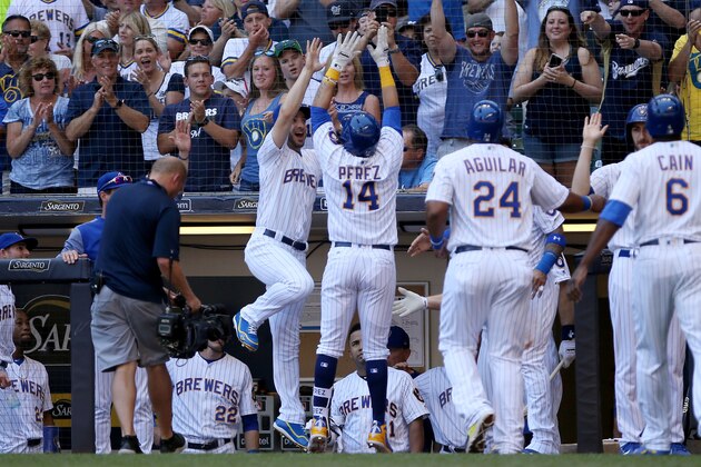 MILWAUKEE, WI - JULY 08:  Hernan Perez #14 of the Milwaukee Brewers celebrates with teammates after hitting a home run in the third inning against the Atlanta Braves at Miller Park on July 8, 2018 in Milwaukee, Wisconsin. (Photo by Dylan Buell/Getty Images)
