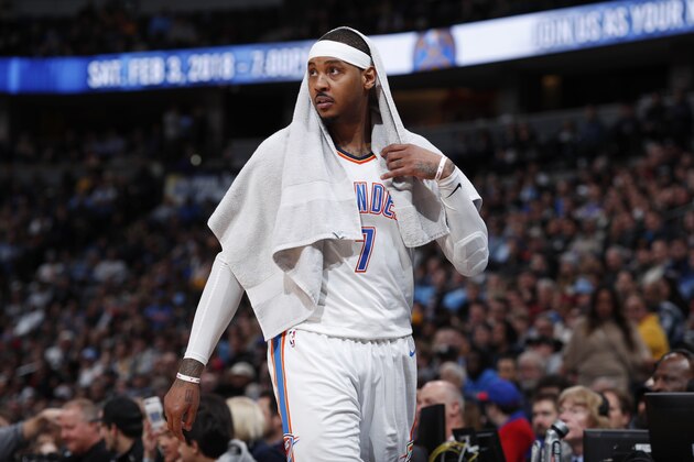 Oklahoma City Thunder forward Carmelo Anthony looks on from the bench in the second half of an NBA basketball game against the Denver Nuggets Thursday, Feb. 1, 2018, in Denver. The Nuggets won 127-124. (AP Photo/David Zalubowski)
