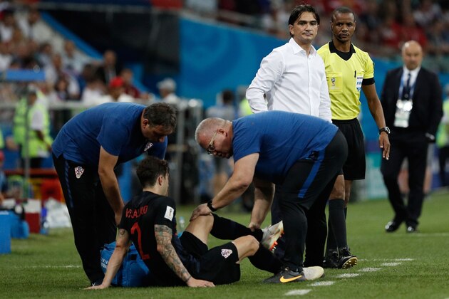 Croatia's defender Sime Vrsaljko receives treatment during the Russia 2018 World Cup quarter-final football match between Russia and Croatia at the Fisht Stadium in Sochi on July 7, 2018. (Photo by Adrian DENNIS / AFP) / RESTRICTED TO EDITORIAL USE - NO MOBILE PUSH ALERTS/DOWNLOADS        (Photo credit should read ADRIAN DENNIS/AFP/Getty Images)