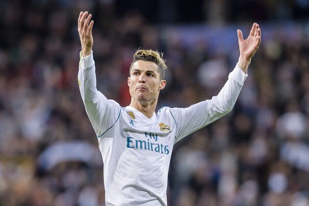 MADRID, SPAIN - APRIL 11: Cristiano Ronaldo of Real Madrid celebrates his side going through to the Semi-Finals of the UEFA Champions League after the UEFA Champions League 2017-18 quarter-finals (2nd leg) match between Real Madrid and Juventus at Estadio Santiago Bernabeu on 11 April 2018 in Madrid, Spain. (Photo by Power Sport Images/Getty Images)
