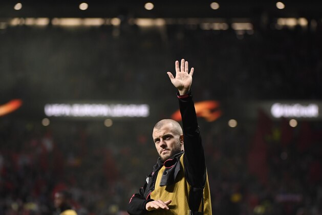 Arsenal's English midfielder Jack Wilshere waves at the end of the UEFA Europa League semi-final second leg football match between Club Atletico de Madrid and Arsenal FC at the Wanda Metropolitano stadium in Madrid on May 3, 2018. (Photo by PIERRE-PHILIPPE MARCOU / AFP)        (Photo credit should read PIERRE-PHILIPPE MARCOU/AFP/Getty Images)