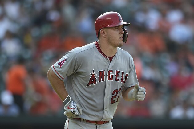 Los Angeles Angels Mike Trout trots to first base on a walk by the Baltimore Orioles in a baseball game, Saturday, June 30, 2018, in Baltimore. (AP Photo/Gail Burton)