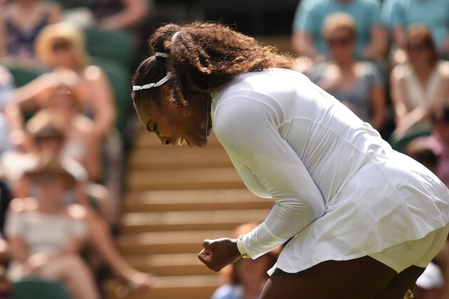 US player Serena Williams reacts while playing Russia's Evgeniya Rodina in their women's singles fourth round match on the seventh day of the 2018 Wimbledon Championships at The All England Lawn Tennis Club in Wimbledon, southwest London, on July 9, 2018. (Photo by Oli SCARFF / AFP) / RESTRICTED TO EDITORIAL USE        (Photo credit should read OLI SCARFF/AFP/Getty Images)