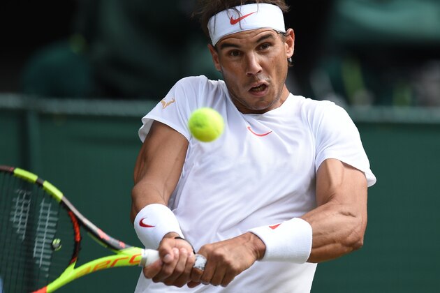 Spain's Rafael Nadal returns to Czech Repbulic's Jiri Vesely in their men's singles fourth round match on the seventh day of the 2018 Wimbledon Championships at The All England Lawn Tennis Club in Wimbledon, southwest London, on July 9, 2018. (Photo by Oli SCARFF / AFP) / RESTRICTED TO EDITORIAL USE        (Photo credit should read OLI SCARFF/AFP/Getty Images)