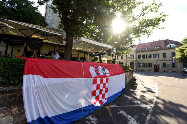 A picture shows a giant national flag put by the cafe owner in the old part Zagreb on July 9, 2018, ahead of the 2018 Russia World Cup semi-final football match between Crotia and England. (Photo by - / AFP)        (Photo credit should read -/AFP/Getty Images)