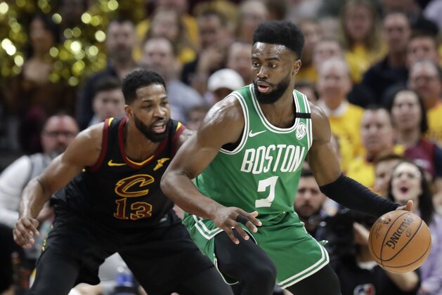 Boston Celtics' Jaylen Brown (7) looks to drive against Cleveland Cavaliers' Tristan Thompson (13) in the first half of Game 4 of the NBA basketball Eastern Conference finals Monday, May 21, 2018, in Cleveland. (AP Photo/Tony Dejak)