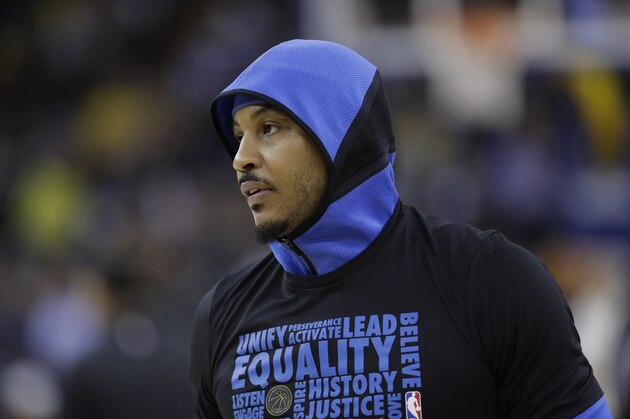 Oklahoma City Thunder's Carmelo Anthony warms up before an NBA basketball game against the Golden State Warriors Tuesday, Feb. 6, 2018, in Oakland, Calif. (AP Photo/Marcio Jose Sanchez)