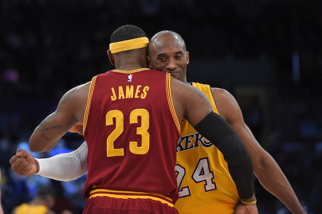 Cleveland Cavaliers forward LeBron James, left, and Los Angeles Lakers guard Kobe Bryant hug prior to an NBA basketball game, Thursday, Jan. 15, 2015, in Los Angeles. (AP Photo/Mark J. Terrill)