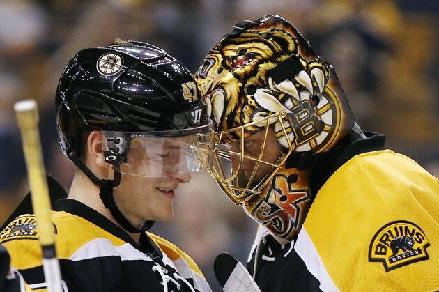 Boston Bruins' Torey Krug (47) celebrates with teammate Tuukka Rask, of Finland, after the Bruins defeated the Buffalo Sabres 4-0 during an NHL hockey game in Boston, Monday, Nov. 7, 2016. (AP Photo/Michael Dwyer)