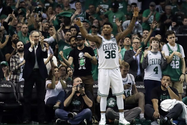 Boston Celtics guard Marcus Smart (36) celebrates near the end Game 5 against the Boston Celtics in the NBA basketball Eastern Conference finals Wednesday, May 23, 2018, in Boston. The Celtics won 96-83. (AP Photo/Charles Krupa)