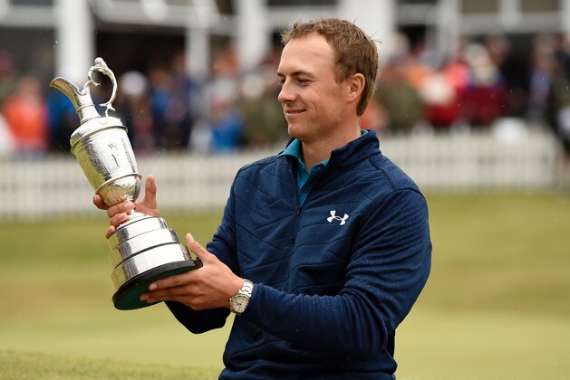 US golfer Jordan Spieth studies names on the Claret Jug, the trophy for the Champion golfer of the year after winning the 2017 British Open Golf Championship at Royal Birkdale golf course near Southport in north west England on July 23, 2017.
Jordan Spieth won the British Open at Royal Birkdale on Sunday by three shots. It is Spieth's third major title after he won the Masters and US Open in 2015. / AFP PHOTO / Andy BUCHANAN / RESTRICTED TO EDITORIAL USE        (Photo credit should read ANDY BUCHANAN/AFP/Getty Images)