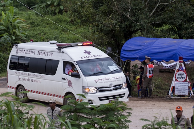 An ambulance leaves the Tham Luang cave area as operations continue for those still trapped inside the cave in Khun Nam Nang Non Forest Park in the Mae Sai district of Chiang Rai province on July 10, 2018. - Rescuers raced to save four young footballers and their coach who remain trapped in a flooded Thai cave on July 10, as heavy rains threatened an already perilous escape mission that has seen eight of the boys extracted in 'good health'. (Photo by YE AUNG THU / AFP)        (Photo credit should read YE AUNG THU/AFP/Getty Images)
