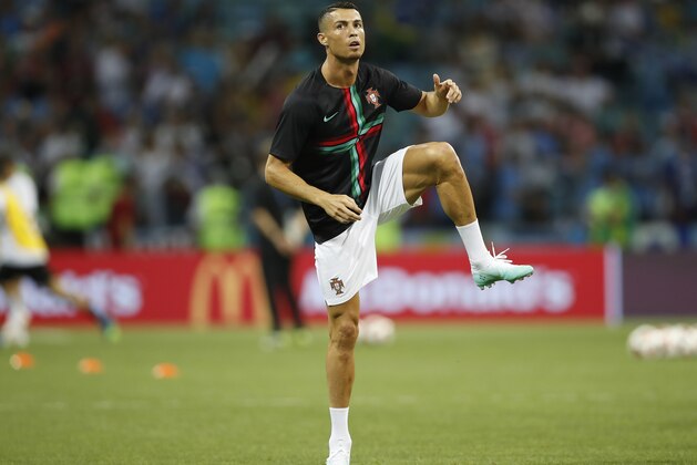 Portugal's Cristiano Ronaldo exercises on the pitch prior the round of 16 match between Uruguay and Portugal at the 2018 soccer World Cup at the Fisht Stadium in Sochi, Russia, Saturday, June 30, 2018. (AP Photo/Francisco Seco)