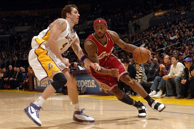 LOS ANGELES - JANUARY 27:  LeBron James #23 of the Cleveland Cavaliers drives against Luke Walton #4 of the Los Angeles Lakers at Staples Center on January 27, 2008 in Los Angeles, California. NOTE TO USER: User expressly acknowledges and agrees that, by downloading and/or using this Photograph, user is consenting to the terms and conditions of the Getty Images License Agreement. Mandatory Copyright Notice: Copyright 2008 NBAE (Photo by Noah Graham/NBAE via Getty Images)