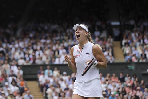 Germany's Angelique Kerber celebrates winning a game during her women's singles quarterfinals match against Russia's Daria Kasatkina, at the Wimbledon Tennis Championships, in London, Tuesday July 10, 2018. (AP Photo/Ben Curtis)