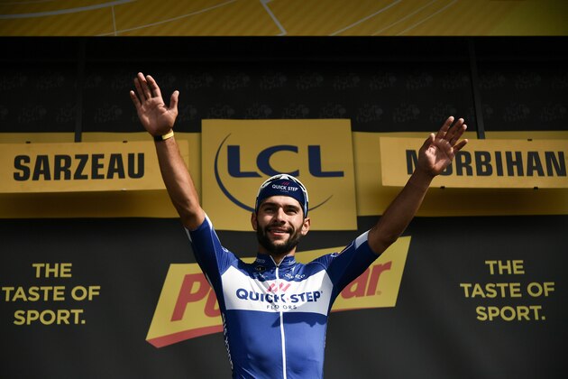Colombia's Fernando Gaviria celebrates on the podium after winning the fourth stage of the 105th edition of the Tour de France cycling race between La Baule and Sarzeau, western France, on July 10, 2018. (Photo by Marco BERTORELLO / AFP)        (Photo credit should read MARCO BERTORELLO/AFP/Getty Images)