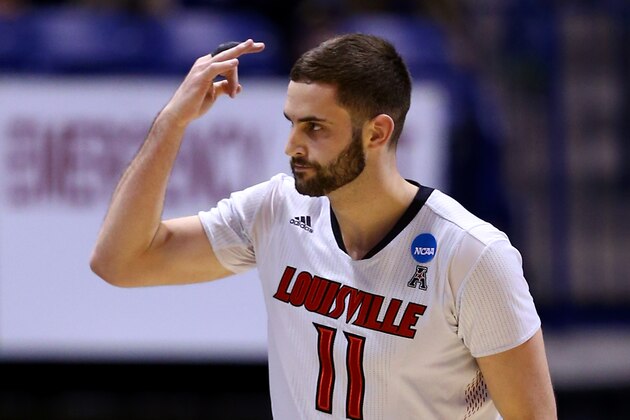 INDIANAPOLIS, IN - MARCH 28:  Luke Hancock #11 of the Louisville Cardinals reacts to a play against the Kentucky Wildcats during the regional semifinal of the 2014 NCAA Men's Basketball Tournament at Lucas Oil Stadium on March 28, 2014 in Indianapolis, Indiana.  (Photo by Andy Lyons/Getty Images)