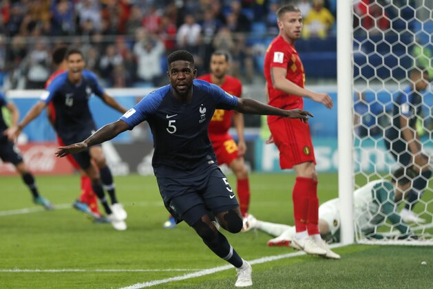 France's Samuel Umtiti celebrates after scoring his sides 1st goal of the game during the semifinal match between France and Belgium at the 2018 soccer World Cup in the St. Petersburg Stadium in, St. Petersburg, Russia, Tuesday, July 10, 2018. (AP Photo/Natacha Pisarenko)