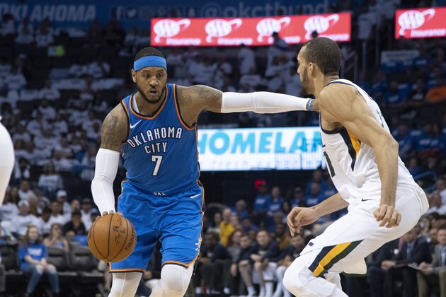 OKLAHOMA CITY, OK - APRIL 25:  Carmelo Anthony #7 of the Oklahoma City Thunder pushes Rudy Gobert #27 of the Utah Jazz during game 5 of the Western Conference playoffs at the Chesapeake Energy Arena on April 25, 2018 in Oklahoma City, Oklahoma. NOTE TO USER: User expressly acknowledges and agrees that, by downloading and or using this photograph, User is consenting to the terms and conditions of the Getty Images License Agreement. (Photo by J Pat Carter/Getty Images)